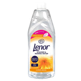 A clear plastic bottle of Lenor Summer Breeze Steamer & Ironing Water (1L) features a vibrant label with a yellow flower, emphasizing easy ironing and long-lasting freshness.